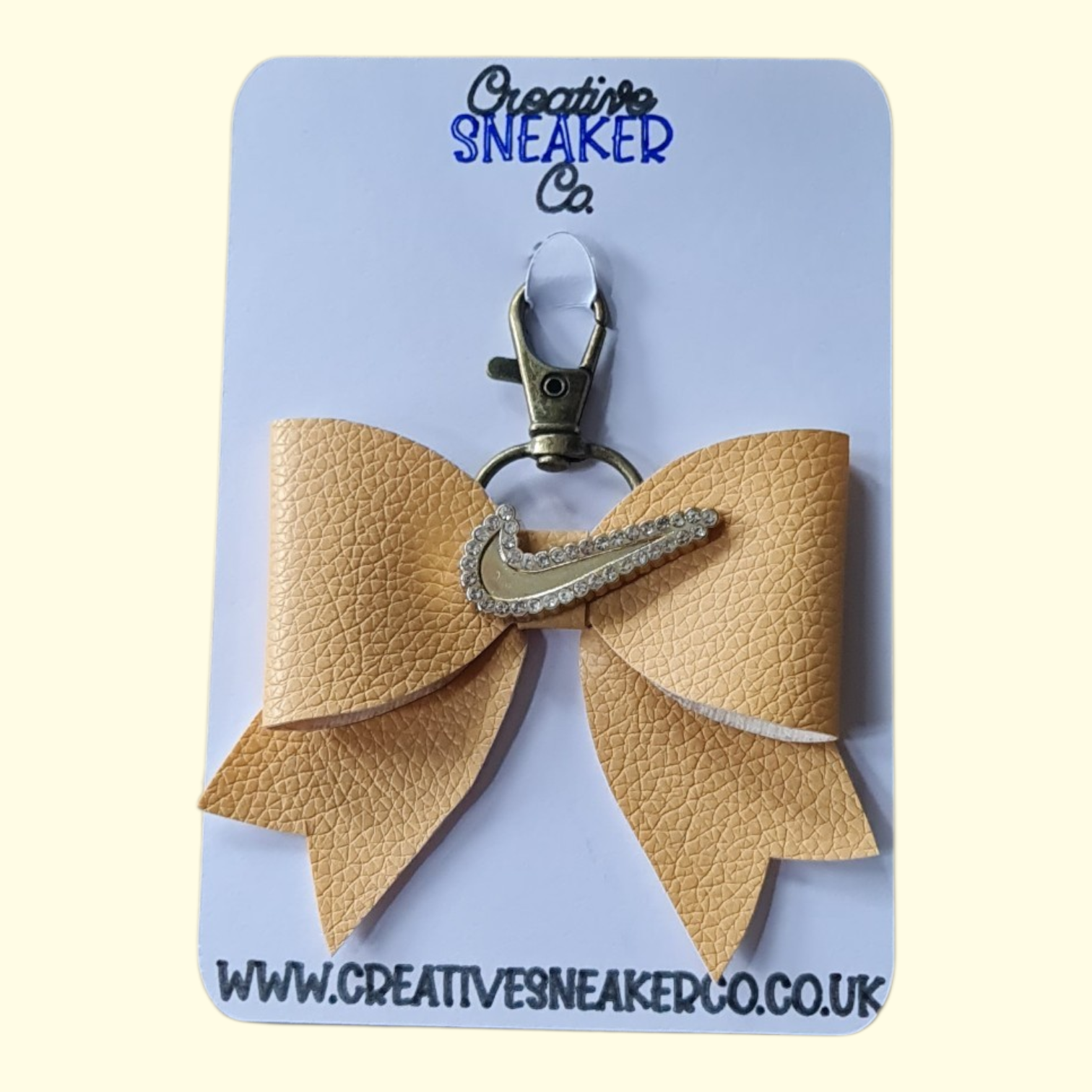 Beige Gold Swoosh Bag Charm